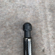 There are small indentions in the socket piece to slip the screw driver in